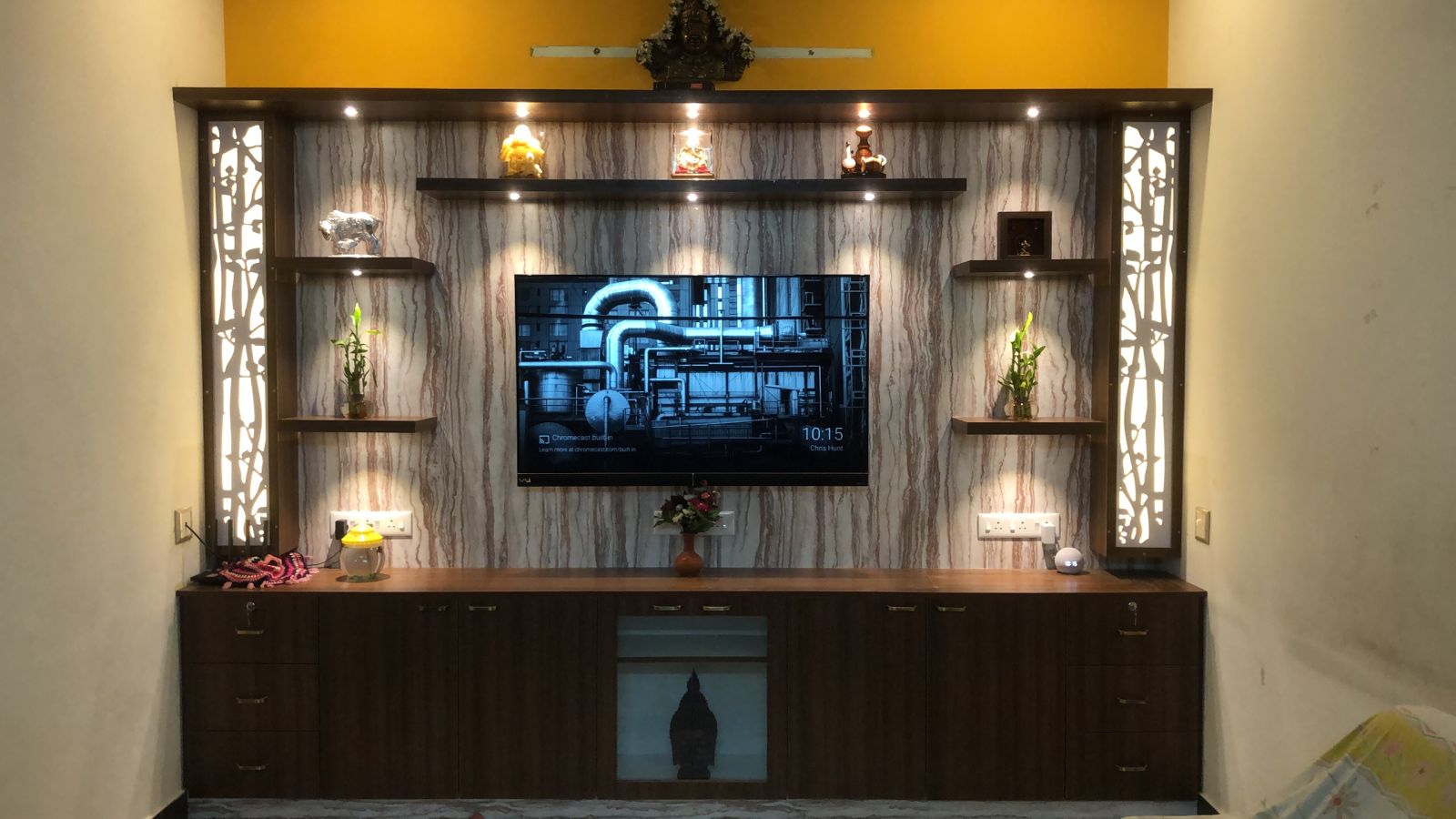 Custom media wall with display shelving and lighting