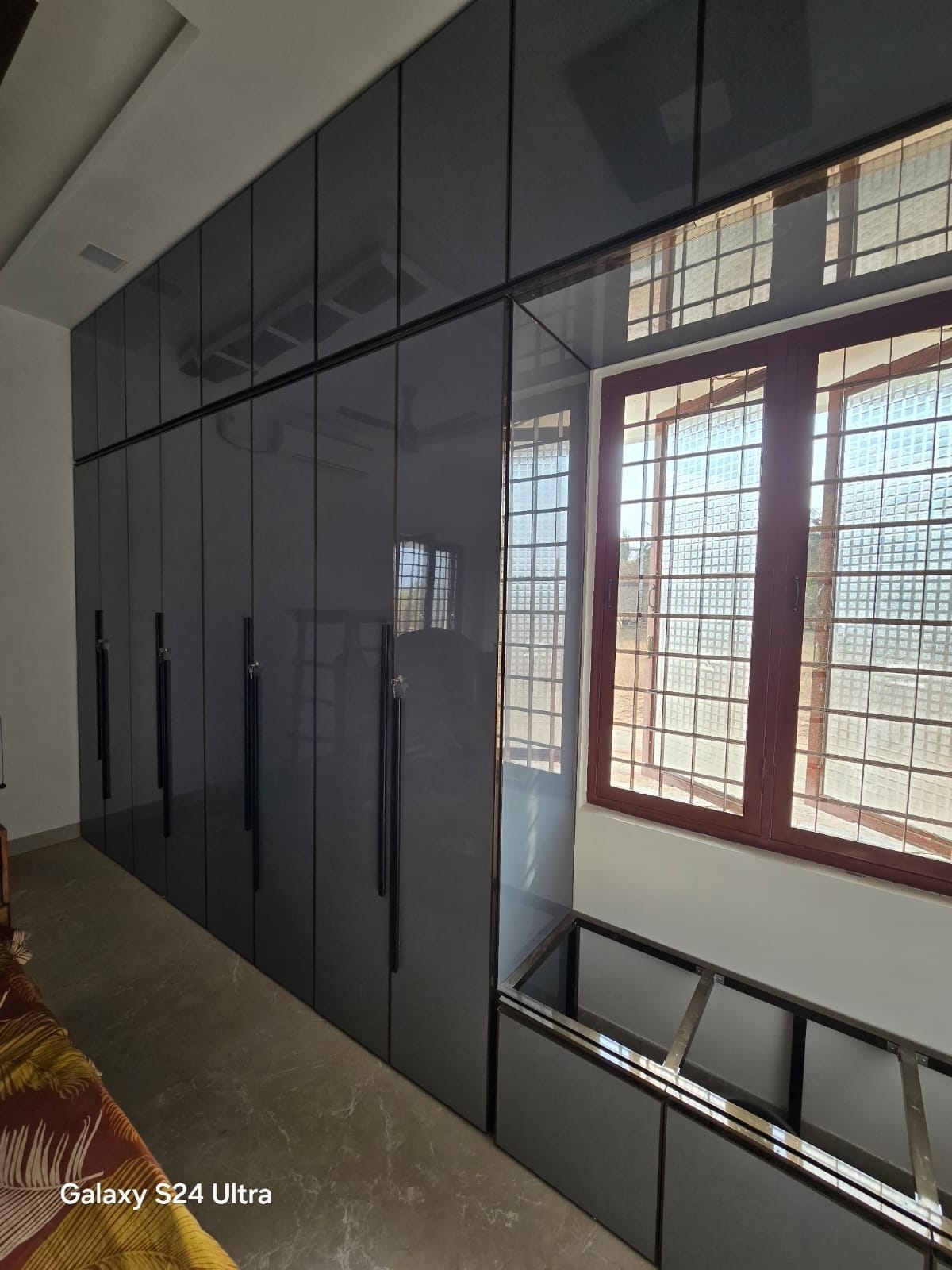 Graphite full-height wardrobe with concealed storage